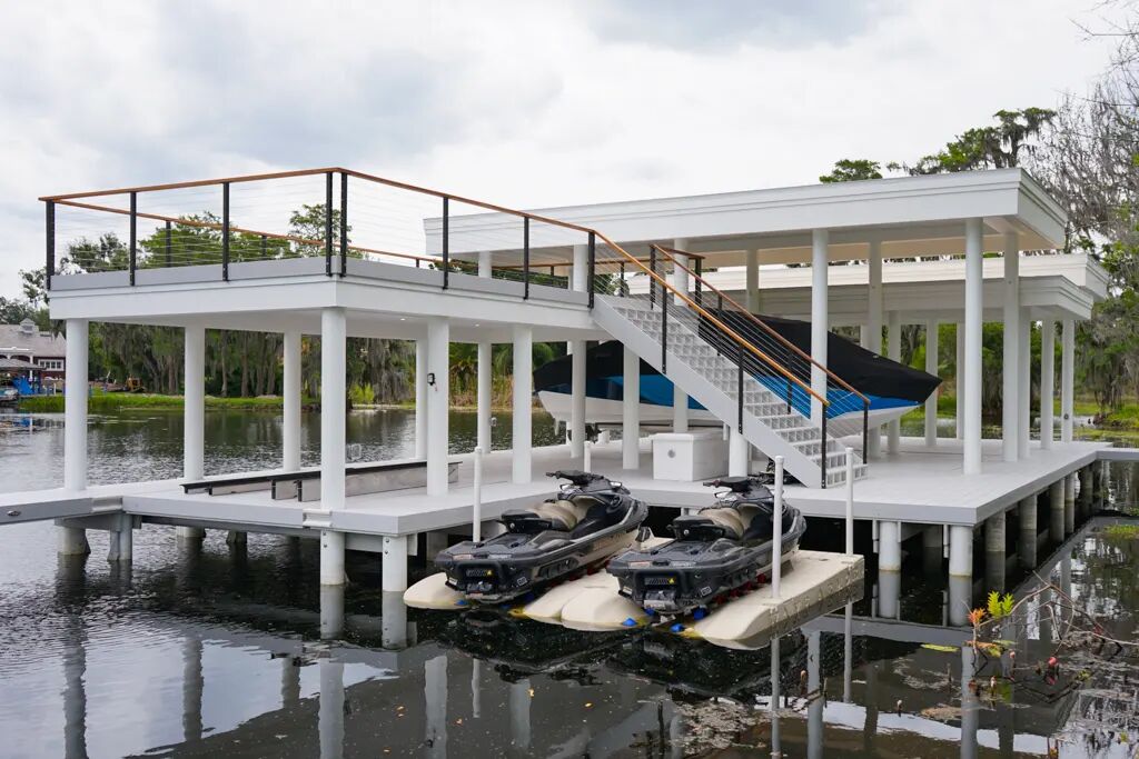 Side view of an elevated AmeriDex boathouse deck with lower-level living space