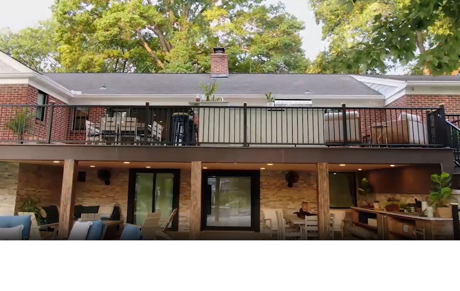 Two-story home with an AmeriDex deck and finished, lit under-deck living space below